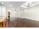 Living room with hardwood floors, a fireplace, recessed lights, and shuttered sliding glass doors at 902 W Glendale Ave # 102, Phoenix, AZ 85021