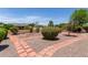 Spacious backyard with lush greenery and a brick-lined pathway at 922 S 80Th St, Mesa, AZ 85208