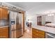 Spacious kitchen featuring stainless steel refrigerator and open layout to the living room at 922 S 80Th St, Mesa, AZ 85208