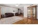 Inviting living room showcasing comfortable seating, a decorative hutch, and hardwood flooring at 922 S 80Th St, Mesa, AZ 85208
