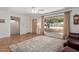 Bright living room with hardwood floors and a large picture window at 922 S 80Th St, Mesa, AZ 85208