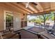 Covered patio with ceiling fan and comfortable seating area perfect for relaxation at 922 S 80Th St, Mesa, AZ 85208