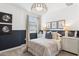 Comfortable bedroom featuring two-toned walls, soft lighting and a bright window at 9819 S 11Th St, Phoenix, AZ 85042