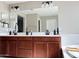 Elegant bathroom featuring a double vanity with matte black fixtures at 984 W Belmont Red Trl, San Tan Valley, AZ 85143
