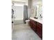 Bright bathroom with tiled floors, a shower-tub combination, and updated fixtures at 984 W Belmont Red Trl, San Tan Valley, AZ 85143