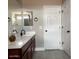 Stylish bathroom featuring dual sinks, a large mirror, and modern fixtures at 984 W Belmont Red Trl, San Tan Valley, AZ 85143