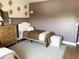 A cozy bedroom provides both comfort and an elegant aesthetic at 984 W Belmont Red Trl, San Tan Valley, AZ 85143