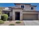 Charming two-story home with a well-manicured front yard and neutral-toned stucco, complemented by a two-car garage at 984 W Belmont Red Trl, San Tan Valley, AZ 85143