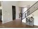 Open foyer with staircase and view into other living spaces, featuring tile flooring at 984 W Belmont Red Trl, San Tan Valley, AZ 85143