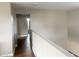 Bright hallway showcases hardwood floors and neutral wall color at 984 W Belmont Red Trl, San Tan Valley, AZ 85143