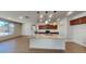 Open concept kitchen featuring a large center island with granite countertops, stainless steel appliances, and modern pendant lighting at 984 W Belmont Red Trl, San Tan Valley, AZ 85143