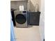 Convenient laundry room featuring a washer, dryer, and utility sink at 984 W Belmont Red Trl, San Tan Valley, AZ 85143