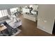 Open-concept area showcases hardwood floors, living room, dining area, and kitchen at 984 W Belmont Red Trl, San Tan Valley, AZ 85143