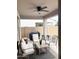 Covered outdoor patio with comfortable seating and ceiling fan, great for entertaining at 984 W Belmont Red Trl, San Tan Valley, AZ 85143