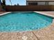Refreshing in-ground pool with a textured concrete surround, perfect for hot summer days at 984 W Belmont Red Trl, San Tan Valley, AZ 85143