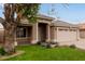 Charming single-story house features a well-kept front yard and a convenient two-car garage at 10280 N 94Th Dr, Peoria, AZ 85345