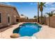 Private backyard pool featuring rock accents, beautiful desert landscaping, and patio area for entertaining at 10280 N 94Th Dr, Peoria, AZ 85345