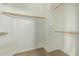 Spacious walk-in closet with carpeted floors and wooden closet rods at 10280 N 94Th Dr, Peoria, AZ 85345