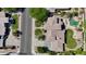 Aerial view of a well-maintained home showcases landscaping, and the surrounding neighborhood at 10434 N 44Th N St, Phoenix, AZ 85028