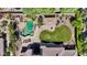 Aerial view of a private backyard oasis featuring a pool, lush landscaping and a covered outdoor kitchen at 10434 N 44Th N St, Phoenix, AZ 85028