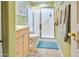 Clean bathroom features a walk-in shower with glass door and a light wood vanity at 10434 N 44Th N St, Phoenix, AZ 85028