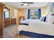 Inviting bedroom with blue accents, a comfortable bed, and natural light from the window at 10434 N 44Th N St, Phoenix, AZ 85028