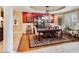 Cozy dining room with elegant chandelier, large wood table and bright windows at 10434 N 44Th N St, Phoenix, AZ 85028