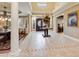 Elegant foyer with soaring ceilings, decorative tile flooring, and grand entryway at 10434 N 44Th N St, Phoenix, AZ 85028