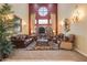 Impressive living room featuring soaring ceilings, custom curtains, and elegant décor at 10434 N 44Th N St, Phoenix, AZ 85028