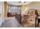 Bedroom with a bay window and sitting area with a decorative wrought iron bed at 10434 N 44Th N St, Phoenix, AZ 85028