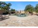 Backyard pool with desert landscaping and a stone waterfall feature at 10434 N 44Th N St, Phoenix, AZ 85028