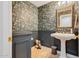 Charming powder room with floral wallpaper, wainscoting, and a pedestal sink at 10434 N 44Th N St, Phoenix, AZ 85028