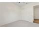This bedroom features neutral carpet, a ceiling fan and a closet with sliding doors at 11872 W Duane Ln, Peoria, AZ 85383