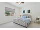 Comfortable bedroom with large windows, neutral tones, and a plush bed at 11872 W Duane Ln, Peoria, AZ 85383