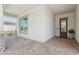 Covered front porch featuring brick flooring, stucco walls, and a stylish front door with glass accents at 11872 W Duane Ln, Peoria, AZ 85383