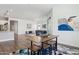 Open-concept living space with wood floors, modern furnishings, and plenty of natural light at 11872 W Duane Ln, Peoria, AZ 85383