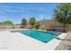 Backyard pool with desert landscaping and safety fence at 11872 W Duane Ln, Peoria, AZ 85383
