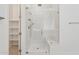 The bathroom has a frameless glass shower and a seat, plus a view into the walk-in closet at 11872 W Duane Ln, Peoria, AZ 85383