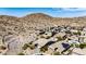 Desert community aerial view with solar panels, lush landscaping, and mountain views, showcasing luxury and sustainability at 12035 S 186Th Ave, Goodyear, AZ 85338