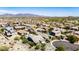 Scenic aerial view of a residential neighborhood with well-spaced homes, desert landscaping, and mountain backdrops, emphasizing community living at 12035 S 186Th Ave, Goodyear, AZ 85338