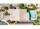 Bird's eye view of the home's roof, showcasing a pristine pool, manicured landscaping, and a well-designed backyard at 12035 S 186Th Ave, Goodyear, AZ 85338