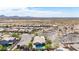 Scenic aerial view of a desert community with homes, landscaping, mountains, and panoramic views of the surrounding landscape at 12035 S 186Th Ave, Goodyear, AZ 85338