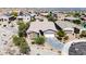 Aerial shot of a well-maintained home with desert landscaping, a spacious driveway, and a two-car garage, blending comfort and style at 12035 S 186Th Ave, Goodyear, AZ 85338
