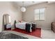 Simple bedroom with stylish mirror, cozy rug, and adequate natural light at 12035 S 186Th Ave, Goodyear, AZ 85338
