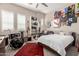 Bedroom with music theme, drumset, guitars, posters, and rug at 12035 S 186Th Ave, Goodyear, AZ 85338