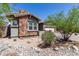 Beautiful single-story home featuring stone accents and mature landscaping in the front yard at 12035 S 186Th Ave, Goodyear, AZ 85338
