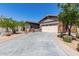 Charming single-story home with a two-car garage and a beautifully paved driveway at 12035 S 186Th Ave, Goodyear, AZ 85338