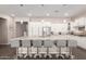 Beautiful, modern kitchen featuring a spacious island, stainless steel appliances, and pendant lighting at 12035 S 186Th Ave, Goodyear, AZ 85338