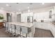 Stylish kitchen features a large center island, stainless steel appliances, and ample cabinet space at 12035 S 186Th Ave, Goodyear, AZ 85338
