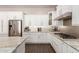 Well-appointed kitchen with stainless steel appliances, granite countertops, and sleek cabinetry at 12035 S 186Th Ave, Goodyear, AZ 85338